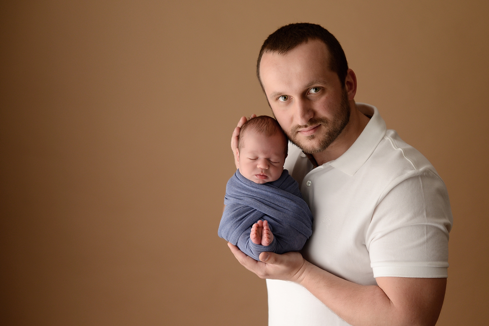 Newborn baby boy with father in Queens Portrait Studio